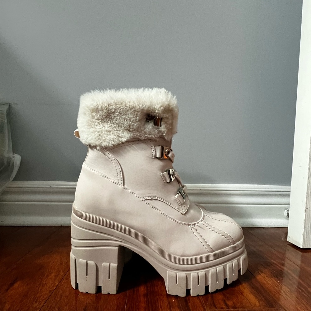 Baby pink fuzzy platform boots
